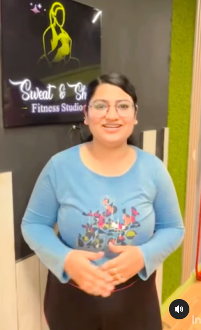 Happy female gym member at Sweat and Shine Fitness Studio in Sector 15 Gurgaon